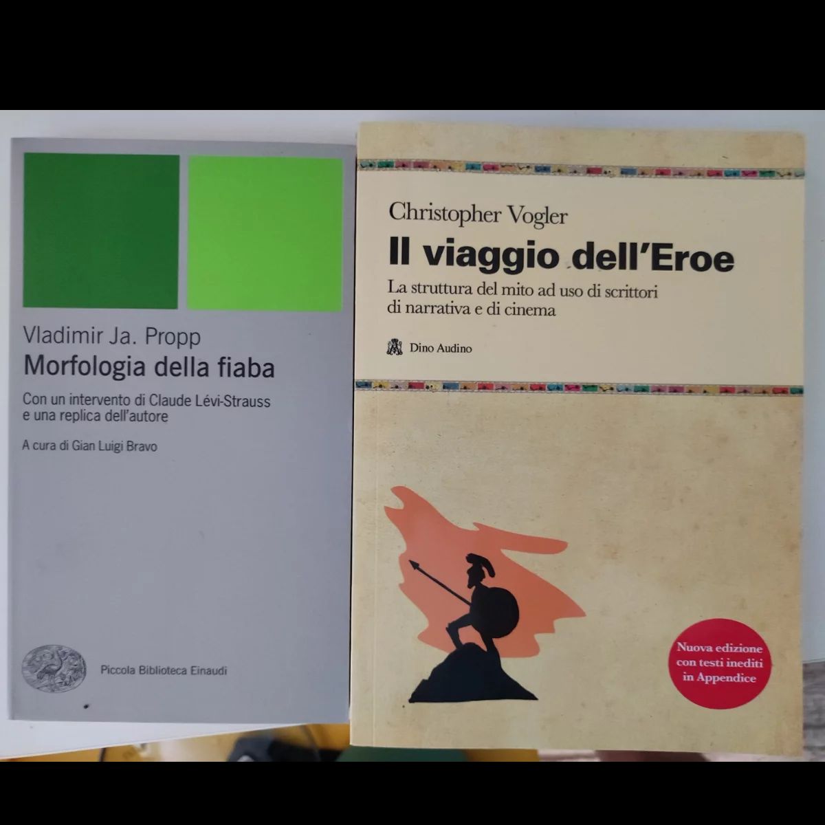 Two books side by side: Vladimir Propp's Morphology of the Folktale and Christopher Vogler's The Writer's Journey, in Italian editions